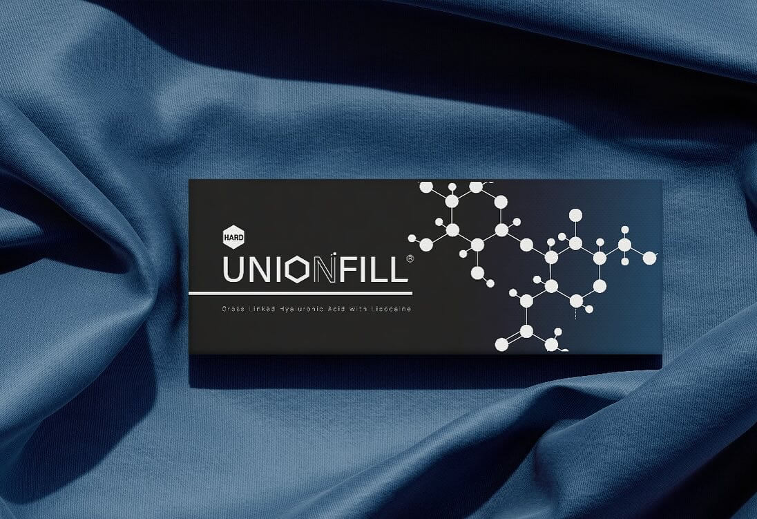 UNIONFILL Hard packaging on a blue fabric background, showcasing its structural gel for deep dermal nourishment and sculpting.