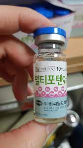 Multi Potent 5 vial held in hand, designed to support health and skin rejuvenation, available at Nutrination.