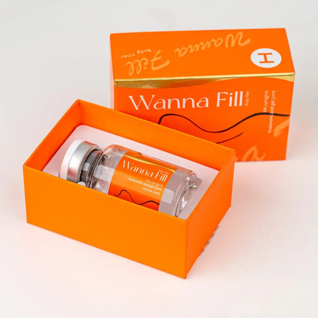 Wanna Fill H body filler packaging, featuring a bottle and vibrant orange box for high-impact sculpting.