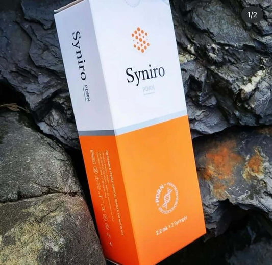 SYNIRO Advanced Skin Booster box on rocky surface, featuring peptides for tissue regeneration and hydration.