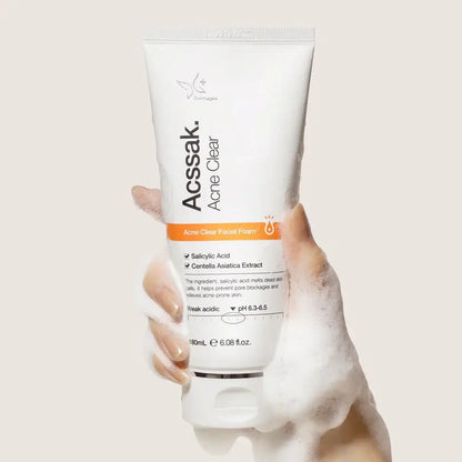 Acssak Foam Cleansing 180ml tube being held with foamy cleanser; deep pore cleansing for all skin types.