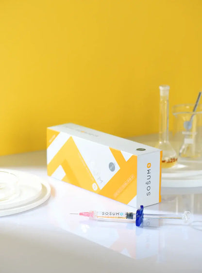 SOSUM S hyaluronic acid gel syringe and packaging on a bright yellow background, ideal for rejuvenation and fine lines.