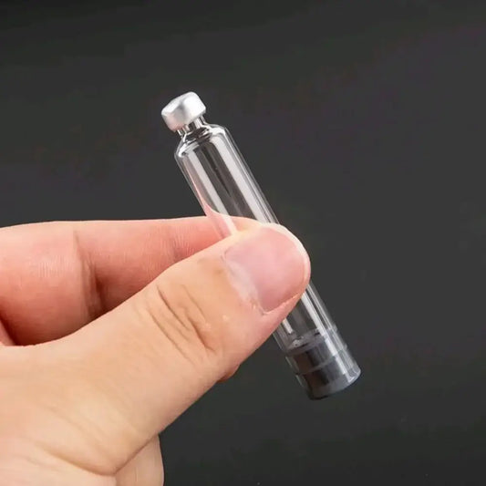 NutriNation 3ml pen vial held in hand, showcasing clear design for precise dosing and compatibility with pen systems.