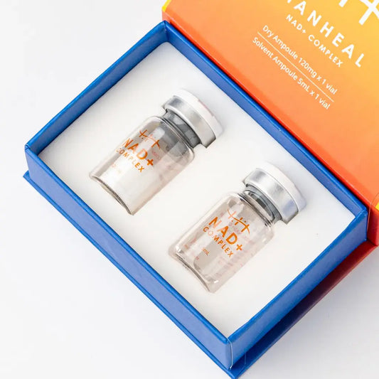 HANHEAL NAD+ complex in two vials inside a vibrant box, promoting cellular revitalization and energy production.