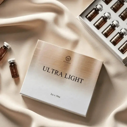 ULTRA LIGHT product packaging with vials for fat reduction, showcasing Nutrination formula for facial contouring.